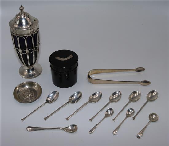Edwardian silver sugar sifter, ebonised tidy, small 800 silver dish, pair of tongs and 10 assorted silver spoons